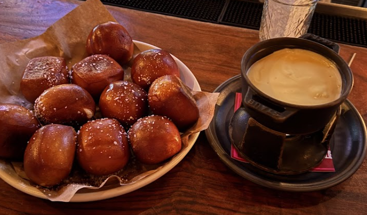 Culinary Dropout signature dishes Soft Pretzels & Provolone FondueShaved Prime Rib Dip36-Hour Pork Ribs